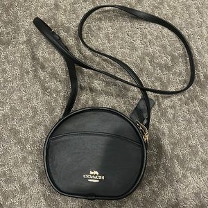 black circle Coach crossbody purse